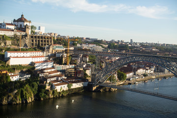 Fototapeta premium View of the Dom Luis I Bridge over the Douro river and the Bank of Vila Nova de Gaia, Porto, Portugal. .