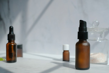 cosmetic skincare packaging . beauty product mock up on luxury white marble with natural light and shadow.