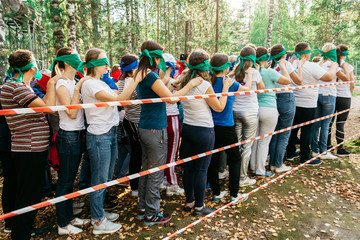 Team in a team building in the forest