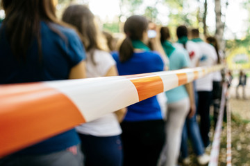 The team tape in the team building in the forest