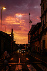 Fototapeta na wymiar Stunning orange red-blooded sunset in historic center in Arequipa, Peru