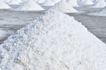 White salt piles on the salt field in Petchaburi province, Thailand.  