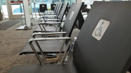 Fototapeta premium Disable chair seats in a new airport with nobody