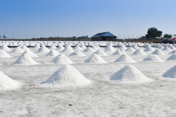 White salt piles on the salt field in Petchaburi province, Thailand.  