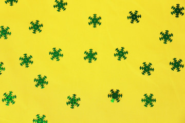 green snowflakes on a yellow background