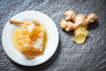 Honey ginger on plate background /