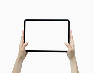 Close-up of hand holding black tablet isolated on white background.