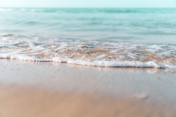 Tropical nature clean beach and white sand in summer with sun light blue sky and bokeh background.
