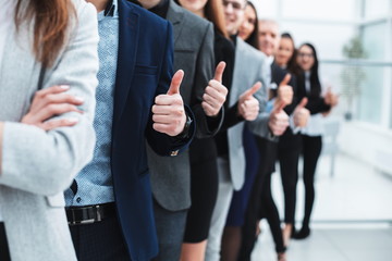 large group of young entrepreneurs showing thumbs up