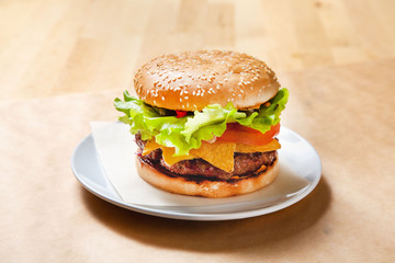 Beef burger on wooden background