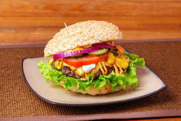 Beef burger on wooden background