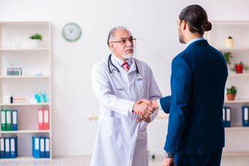 Male doctor and businessman discussing medical project