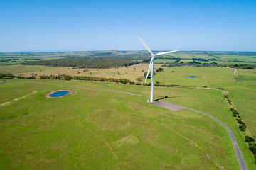 Aerial view of wind turbine in green field