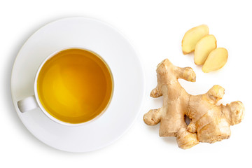 Closeup hot ginger tea in ceramic cup with fresh organic ginger root with slice isolated on white background . Top view. Flat lay.
