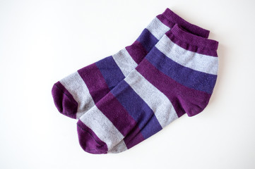 Socks with colored stripes on a light background