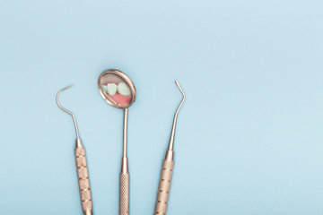 Dental tool in dental office, mirror and hook. Dental care concept