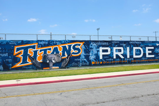 FULLERTON CALIFORNIA - 23 MAY 2020:  Closeup of the Titans Pride Banner on the tennis court fence on teh campus of California State University Fullerton, CSUF.