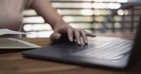Close up Woman working at home office hand on keyboard for working or learning online