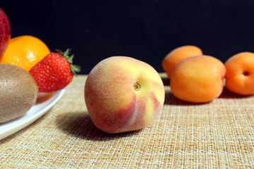 Ripe nectarine fruit on the background of different fruits