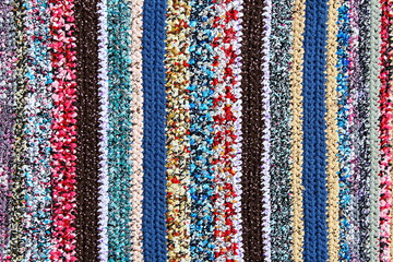 Vertical pattern of different colors knitted rug