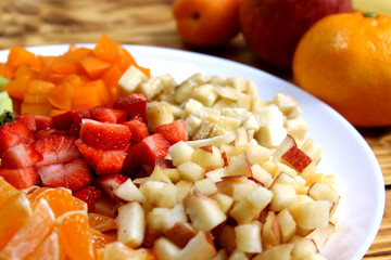 Chopped fruit salad in a white plate