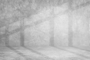 Empty space studio room of Plaster cement concrete wall texture background with shading for interior design and product showing.