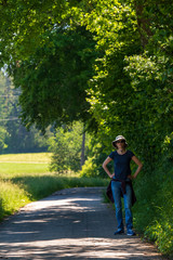 Fototapeta na wymiar young woman walking in the countryside during summer