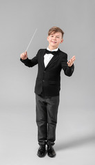 Little conductor on grey background