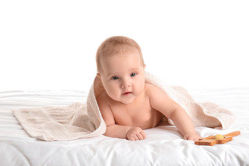 Cute little baby with towel on white background