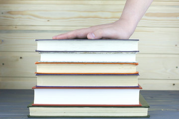 Stack of Books on the table in library.
