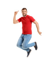 Handsome young man dancing against white background