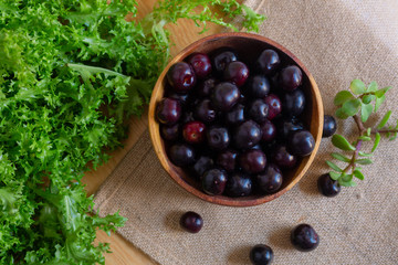 Blackcurrant, black berries for dessert, tea on a white background