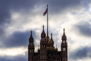 Fototapeta na wymiar Tower with flag of Union Jack flying - Westminster, houses of parliament,London,UK