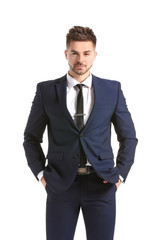 Handsome young man in elegant suit on white background