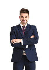 Handsome young man in elegant suit on white background