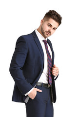 Handsome young man in elegant suit on white background