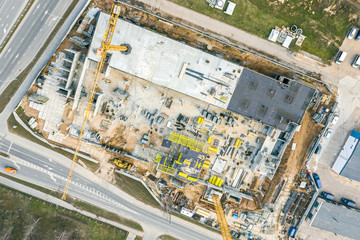 construction of new multistory apartment building in residential area. aerial view