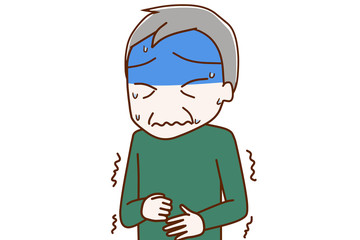お腹が痛くて真っ青になっている高齢の男性