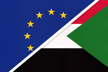 European Union or EU and Sudan national flag from textile. Symbol of the Council of Europe association.