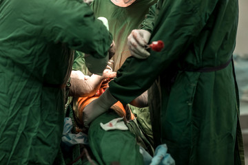 Arthroscope surgery. Orthopedic surgeons in teamwork in the operating room with modern arthroscopic...