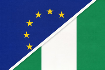 European Union or EU and Nigeria national flag from textile. Symbol of the Council of Europe association.