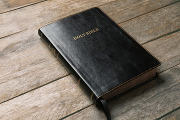 Holy Bible on wooden background