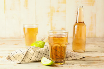 Glassware of fresh apple cider on table