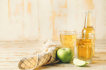 Glassware of fresh apple cider on table