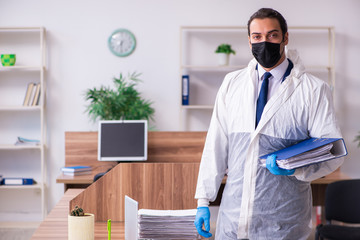 Young male employee in self-isolation concept