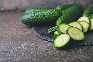 Fresh green cucumbers on table