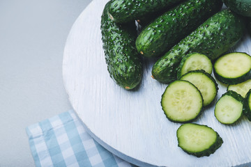 Fresh green cucumbers on table
