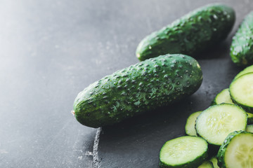 Fresh green cucumbers on table