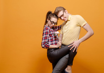funny students in love on a yellow background