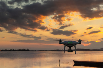 drone flying over the beach at sunset